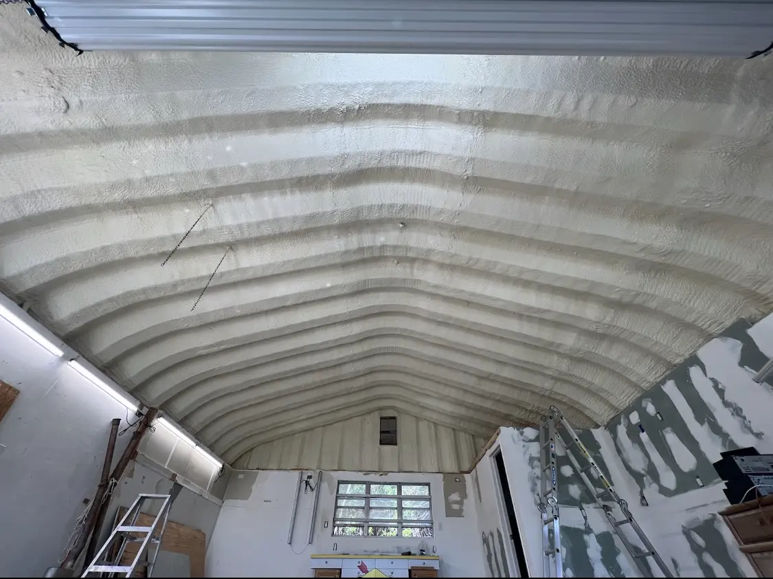 Spray polyurethane foam applied to the underside of a metal roof deck in Pearsall
